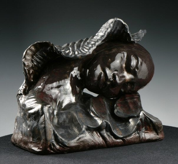 Hand-built figurative sculpture exploring marine ecological grief in clay