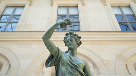 A classical figurative sculpture set in elegant gallery architecture