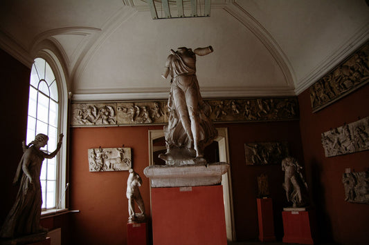 Figurative sculptures displayed in a gallery setting
