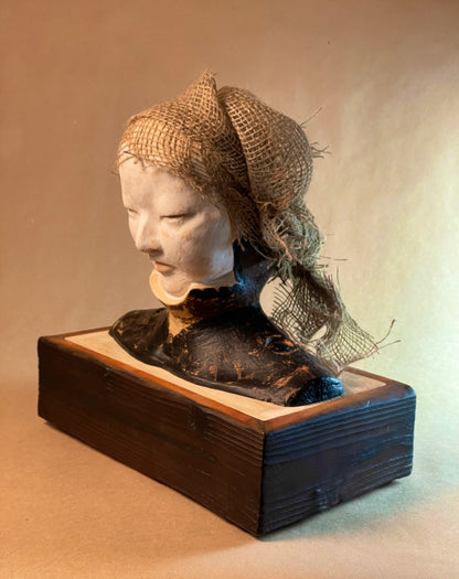 Sculpture of asian woman side view