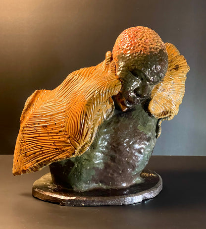 Sculpture of a ram with textured fur on a dark background