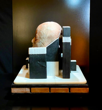 Abstract sculpture with geometric shapes on a dark background