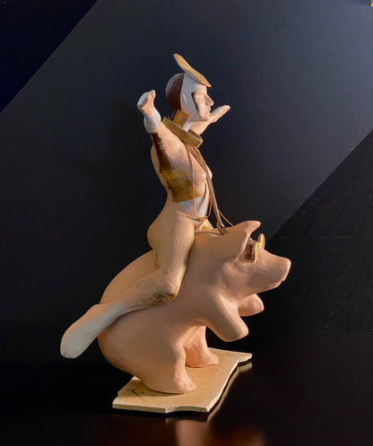 sculpture of woman riding a pig side view