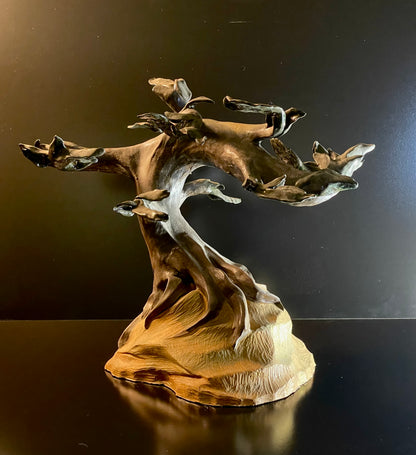 sculpture of tree on a dark background back view